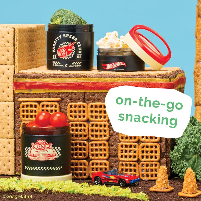 Snack containers with snacks and a toy car on a miniature road and snack background, featuring the text 'on-the-go snacking'.