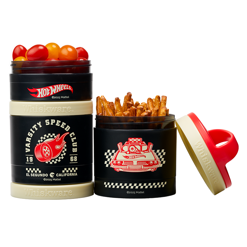 Two Hot Wheels-themed snack containers filled with cherry tomatoes and pretzel