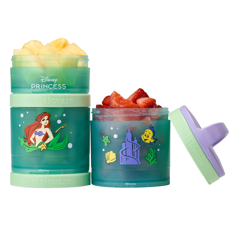 Ariel snack container with pineapple & strawberries inside.