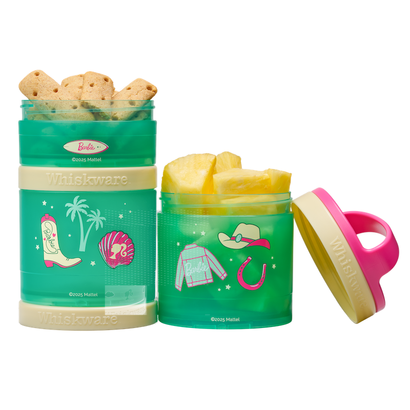 Two green snack containers with Barbie western designs. One filled with crackers, the other filled with pineapple.