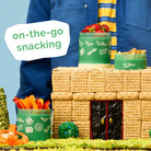 Hot Wheels snack set with green containers and snacks on a blue background