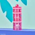 Pink stacked snack containers with Barbie branding on a blue background