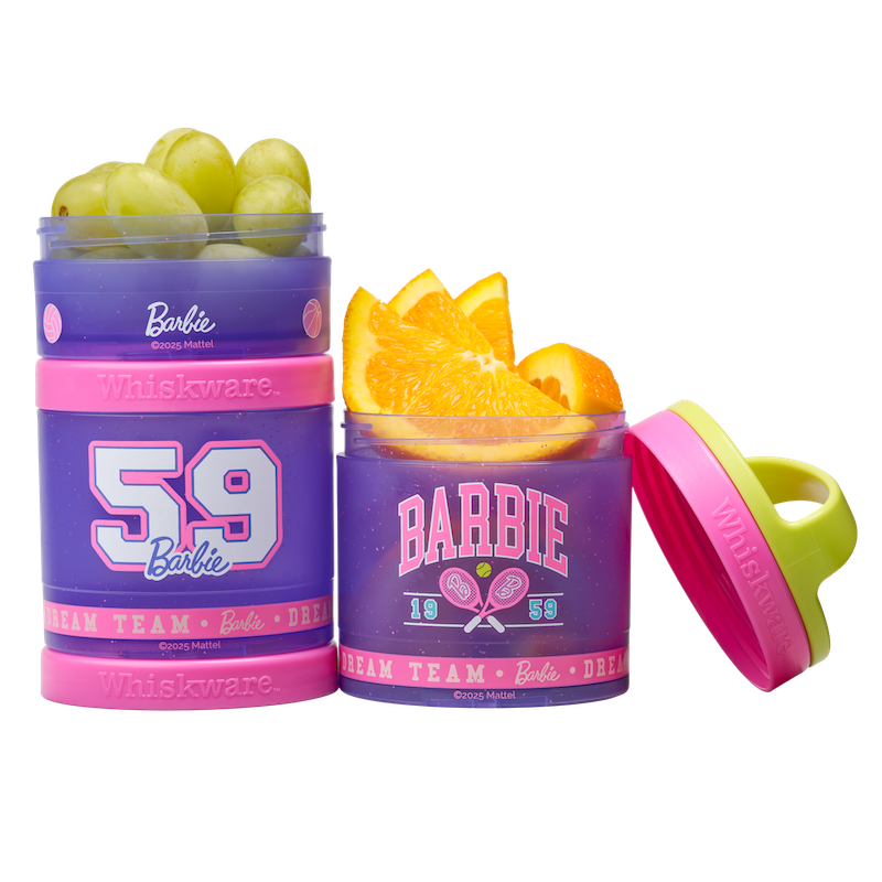 Two Barbie-themed snack containers filled with fruits.